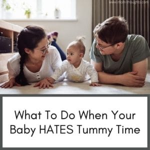This image shows a picture of a mom and dad on the floor with their baby doing tummy time. The baby is in between the mom and dad. Text at the bottom says "What to do when your baby hates tummy time"