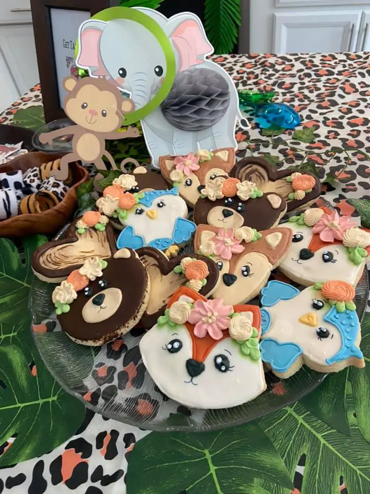 This image is of a large plate of animal cookies at a young wild and three birthday party